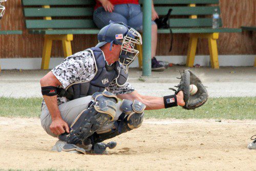 MARK MOISE did the catching honors when North Reading Baseball held its annual Alumni Game on Memorial Day at Carey Park. (Leslie Gordon Photo)