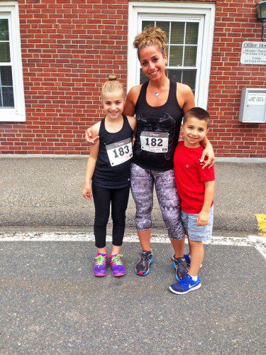 ALL IN THE FAMILY. Adriana and Paul Buccilli of Lynnfield ran the LAA Fourth of July Road Race with their aunt, Grace Balian. Adriana, 8, won third place among girls age 10 and under in 41.48. Grace finished in 41.47 and Paul, 5, ran an unofficial time of 42.20. (Courtesy Photo)