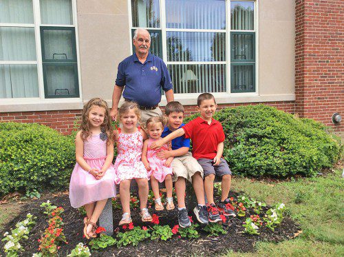 JEANNE HUDD’S grandchildren, from the left: Anna Hudd, Gabriella Larosee, Arianna Larosee, Andrew Larosee and Ryan Hudd. Pictured in the background is Jeanne’s husband Ron.
