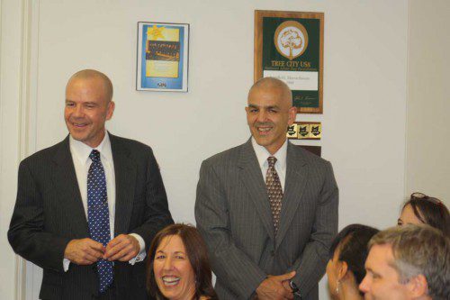 CAPTAIN Karl Johnson (left) and Sgt. Al Scotina share a laugh during their promotion ceremony at the July 13 selectmen's meeting attended by family, friends and colleagues. (Maureen Doherty Photo)
