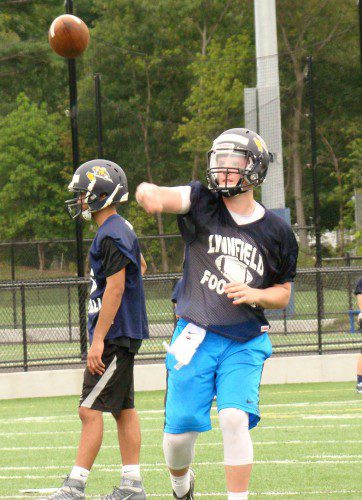 SENIOR QUARTERBACK Jake McHugh lets one fly during a passing drill Monday morning. (Tom Condardo Photo)