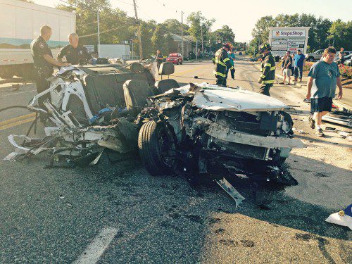 THE DRIVER OF THIS CAR, a Chevrolet Impala, survived the crash with a tractor trailer on Route 28 near North Reading Subaru. (Photo Courtesy NRFD)