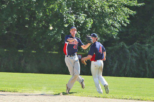 MELROSE SHORTSTOP Austin Masel (#41) makes the throw to first as Chris Sharpe (#4) looks on. The Americans tied the Arlington Trojans for sixth place but missed out on the final Intercity League playoff spot due to the head-to-head tiebreaker. (Donna Larsson File Photo)