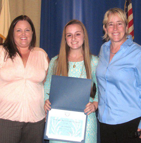 WAKEFIELD MEMORIAL HIGH SCHOOL senior Jessica Dubuque, center, received the Superintendent's Award for Excellence at last night's School Committee meeting. Presenting the award were School Superintendent Dr. Kim Smith, right, and School Committee Chairman Kate Morgan. (Mark Sardella Photo)