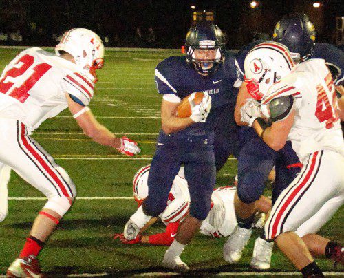 CAPT. DREW McCARTHY scores his first TD of the night against the Indians. He rushed for two TDs and scored again on a 50-yard TD pass in the victory. (Tom Condardo Photo)