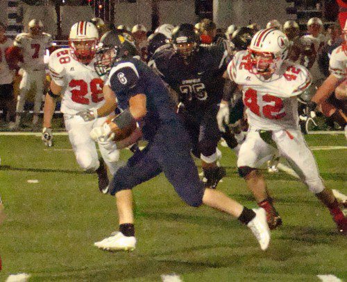 SOPHOMORE Andrew DePalma (6) glides through the Amesbury defense for a 17 yard gain in the third quarter. He capped the drive with a two-yard blast. (Tom Condardo Photo)