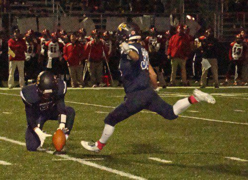 DAN BRONSHVAYG (33) boots a second quarter field goal to give the Pioneers a 17-12 lead over Watertown. Alex Boutris holds the ball steady. (Tom Condardo Photo)