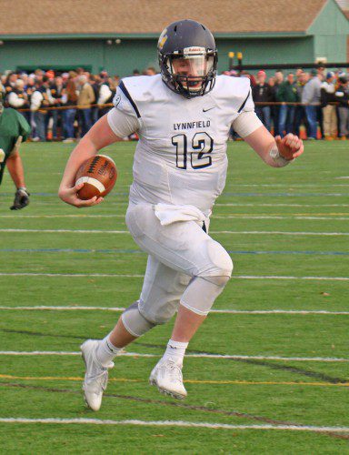 PLAYMAKER. Quarterback Jake McHugh is off and running on a 19-yard TD run to give the Pioneers a 14-10 first half lead. It was his second TD of the day. (Tom Condardo Photo)