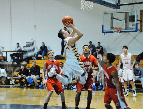 SENIOR Tucker Torosian (21) helped the Pioneers defeat Manchester-Essex 64-38 on Jan. 22 after finishing with 14 points, six rebounds and three steals. (Courtesy Photo)