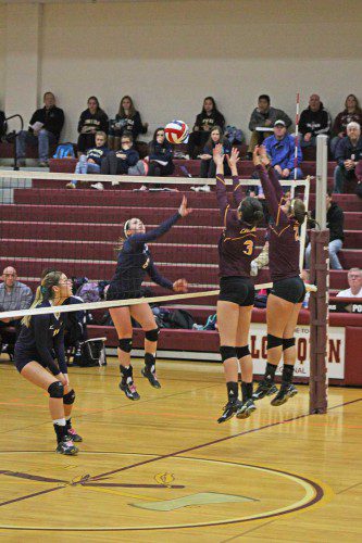 CO-CAPTAIN Olivia Pascucci makes a crucial hit that two Case opponents cannot block to score the opening point in game 3 of the Div. 3 state semifinals. (Maureen Doherty Photo)