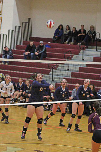 SETTER Emory Caswell (19) handles this ball perfectly to set up the play for her teammates in the third game of the state semifinals against Case High School. (Maureen Doherty Photo)