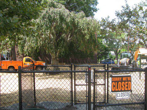 DPW WORKERS are in the process of putting down a new surface at the Wakefield Dog Park on Main Street in the Junction. Last May, Town Meeting approved $6,000 for a new surface, which will be mulch. Workers are currently putting a base layer of sand down. The mulch will go on top. DPW Director Richard Stinson could not give an exact date when the Dog Park will re-open, but said that the resurfacing project should not take much longer to complete. (Mark Sardella Photo)